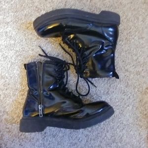 Shiny black combat boots